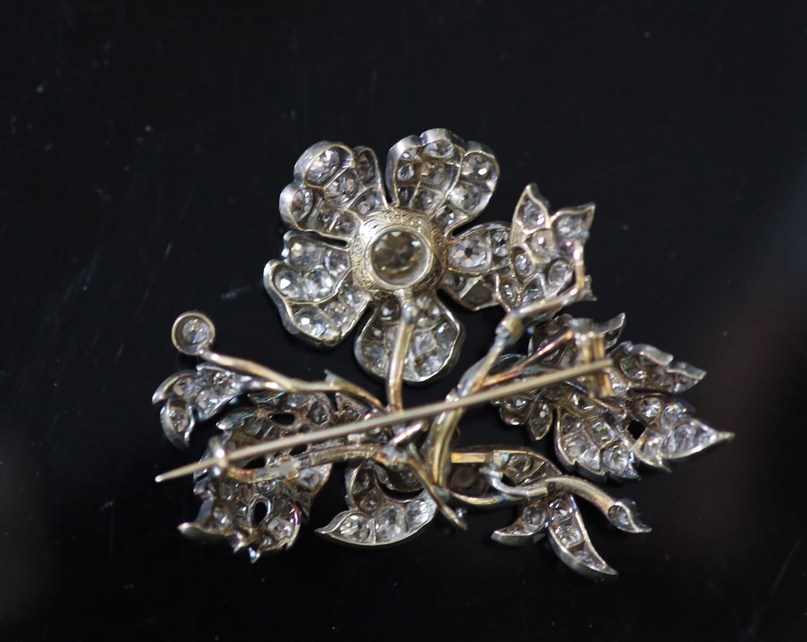 A Victorian gold, silver and diamond encrusted floral spray brooch